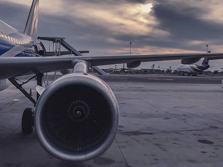 A close of of an aircarft wing and the engine
